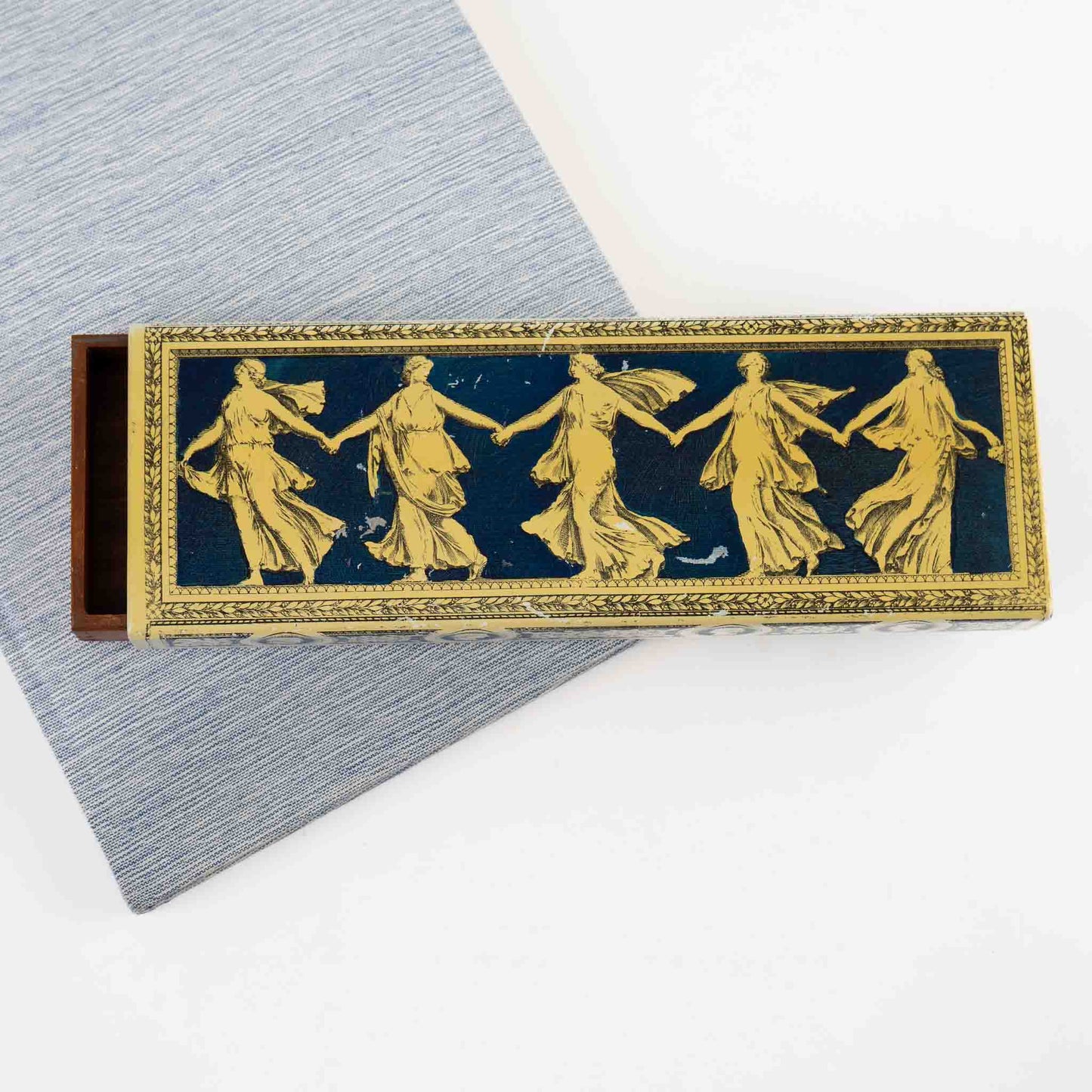 Vintage metal decorative box with Greek dancing muses design and sliding wooden interior compartment for jewelry storage