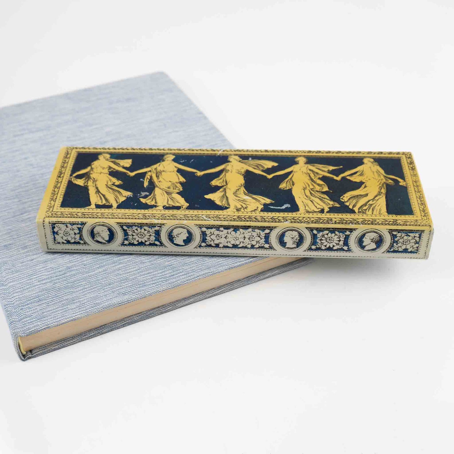 Vintage metal decorative box with Greek dancing muses design and sliding wooden interior compartment for jewelry storage