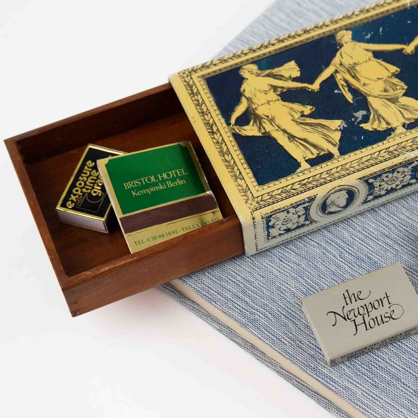 Vintage metal decorative box with Greek dancing muses design and sliding wooden interior compartment for matchbook storage
