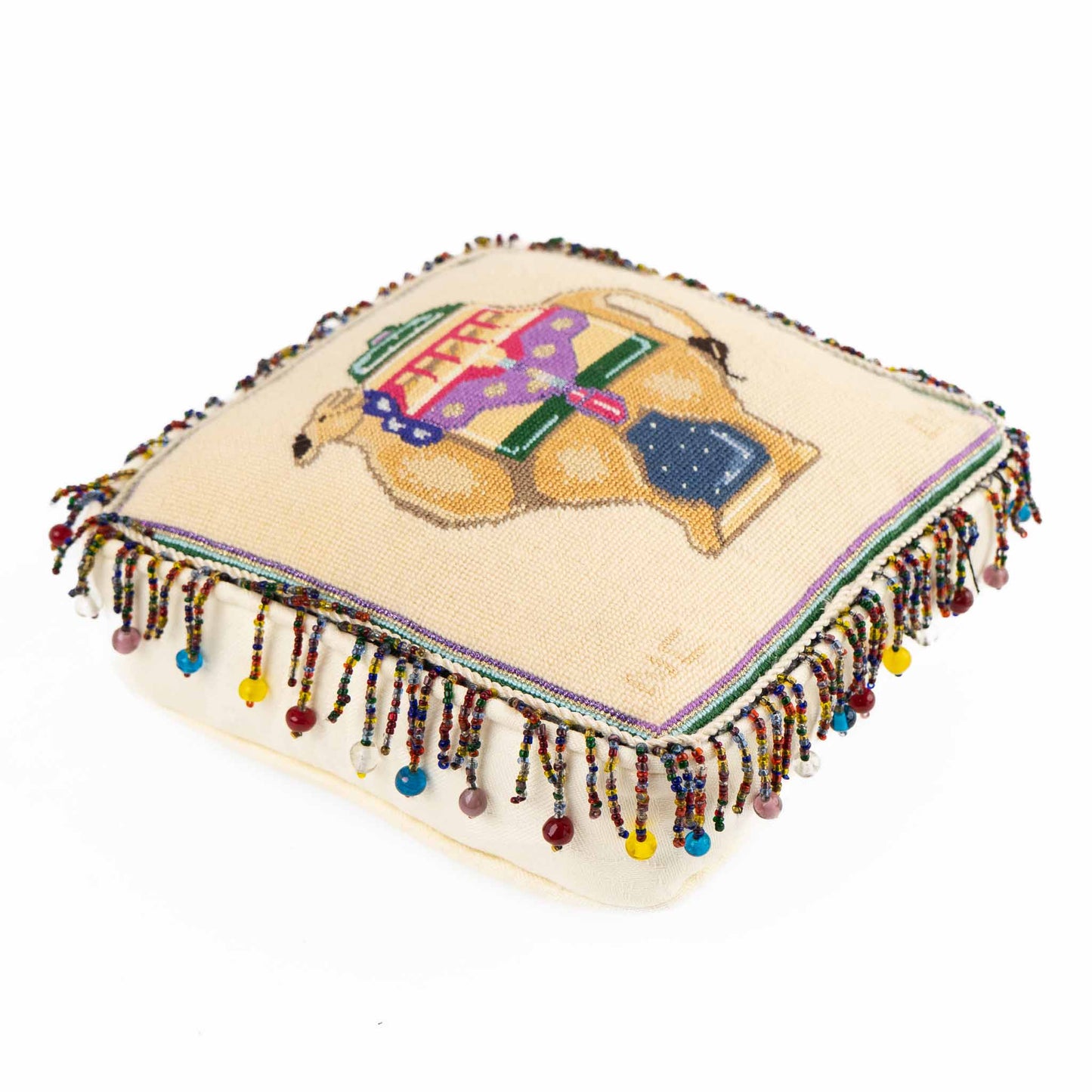 Vintage square needlepoint pillow with hand-stitched camel design and decorative beaded trim around edges