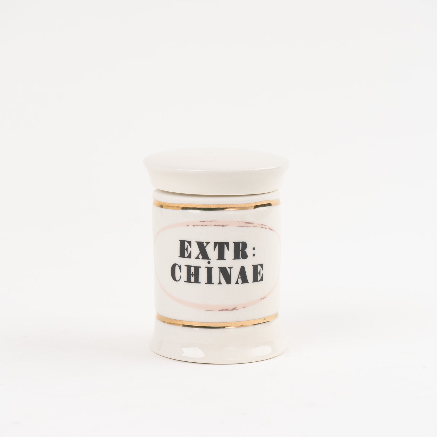 Extr Chinae off-white ceramic apothecary jar with gold accents and vintage pharmaceutical-style lettering, with matching lid