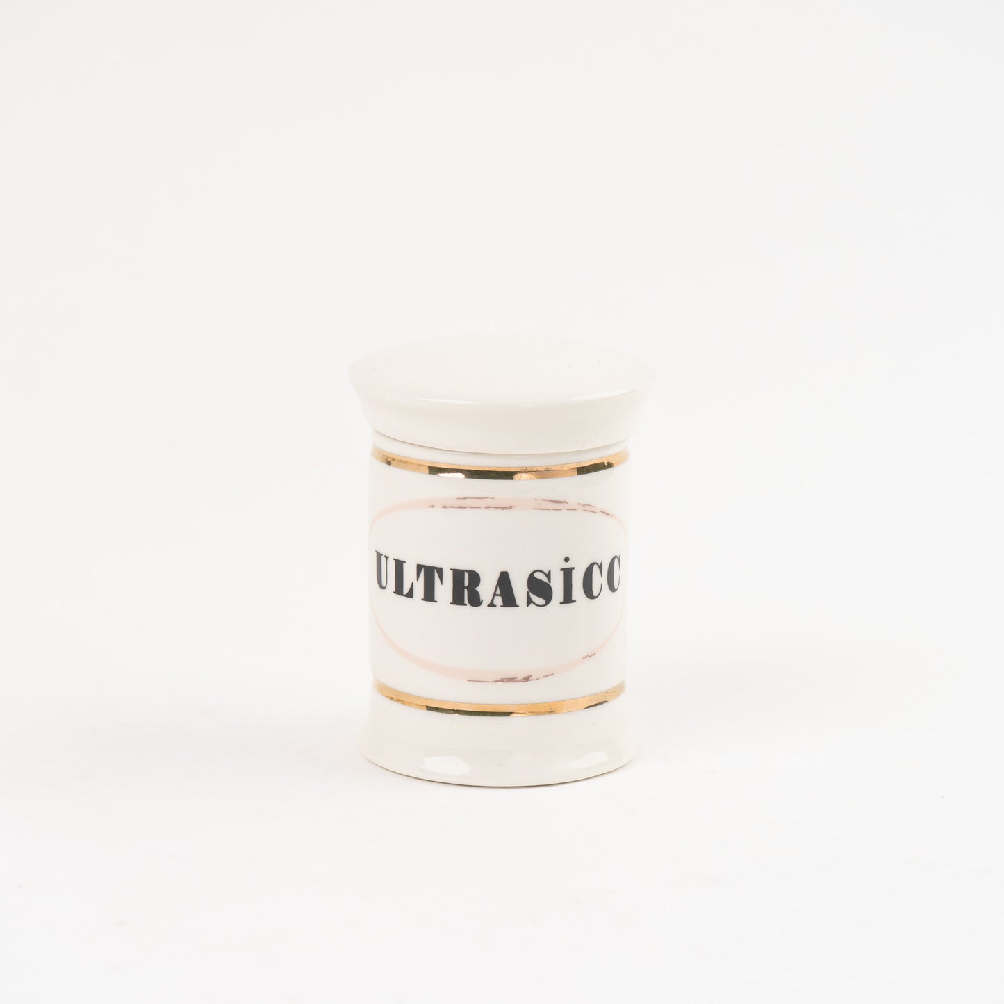 Ultrasicc off-white ceramic apothecary jar with gold accents and vintage pharmaceutical-style lettering, with matching lid