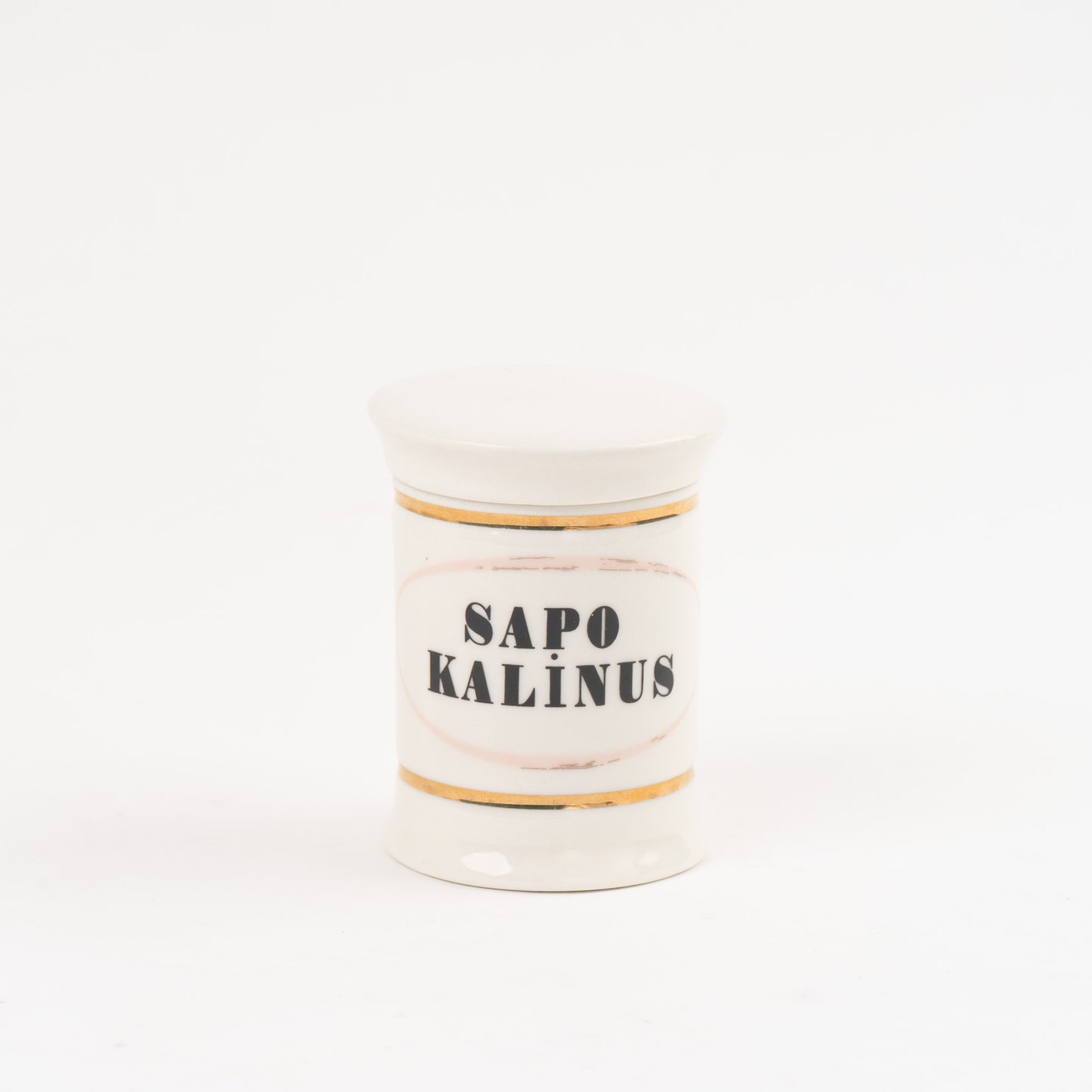 Sapo Kalinus off-white ceramic apothecary jar with gold accents and vintage pharmaceutical-style lettering, with matching lid