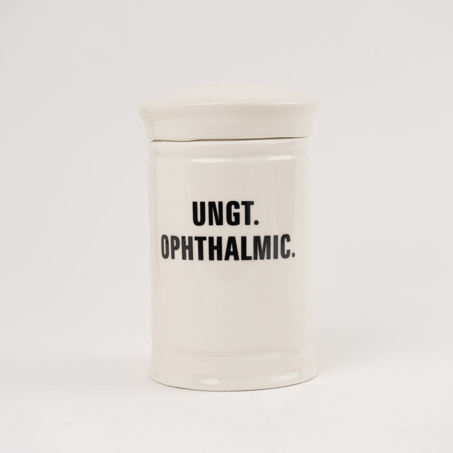 Ungt Opthalmic Off-white ceramic apothecary jar with black vintage lettering and matching lid