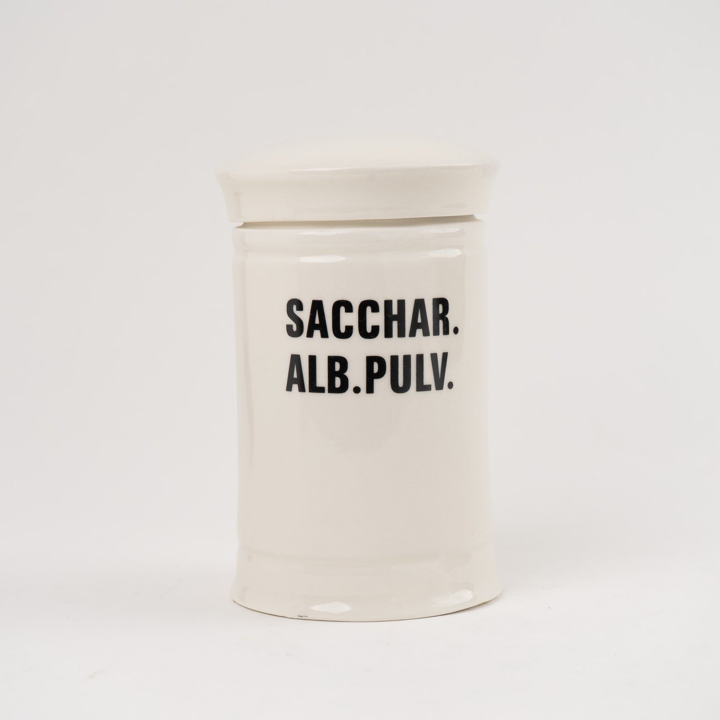 Sacchar Alb Pulv Off-white ceramic apothecary jar with black vintage lettering and matching lid