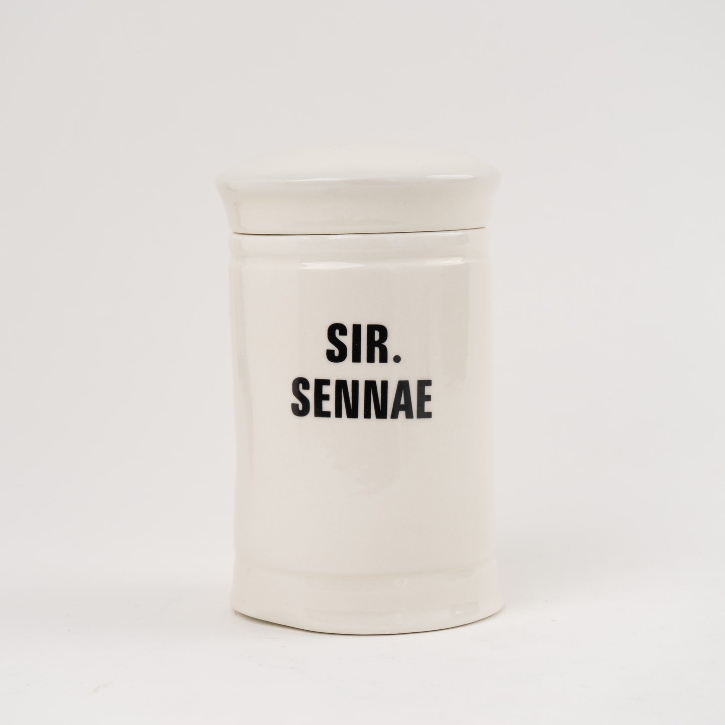 Sir Sennae Off-white ceramic apothecary jar with black vintage lettering and matching lid