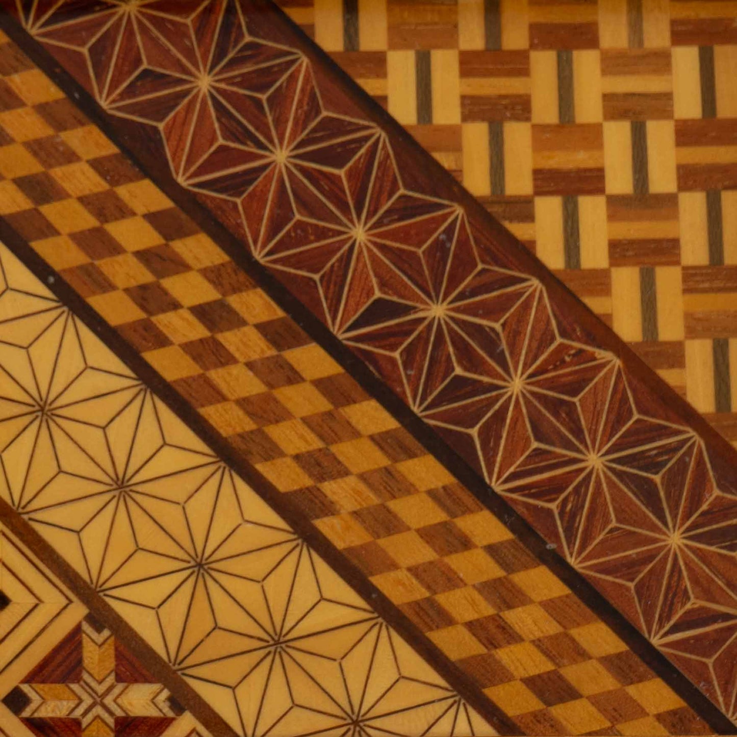 wood marquetry tray featuring six geometric patterns with contrasting wood tones and intricate inlay patterns