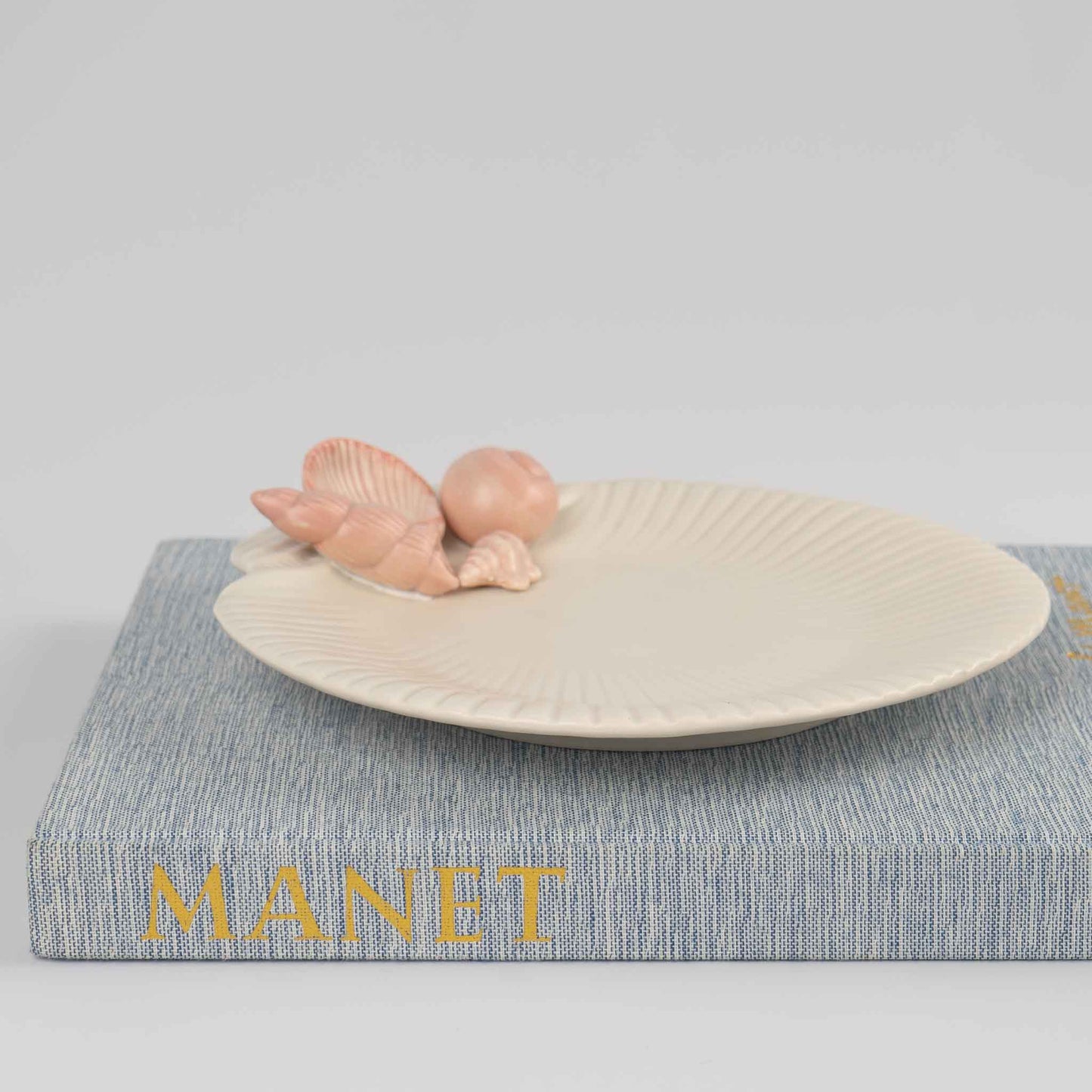 Vintage 1976 Fitz and Floyd ceramic seashell plate in off white with soft pink shell details