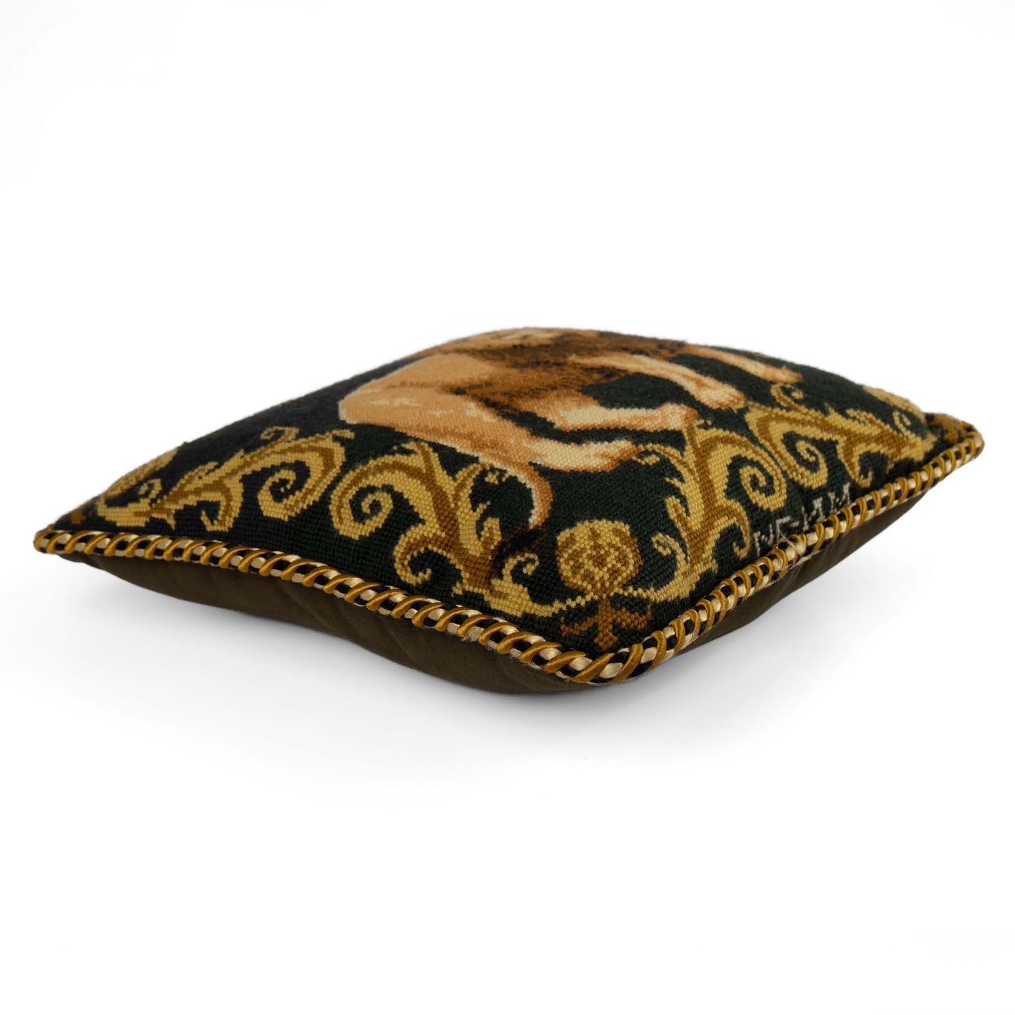 Vintage square needlepoint pillow featuring embroidered lion with decorative scroll border and braided rope piping