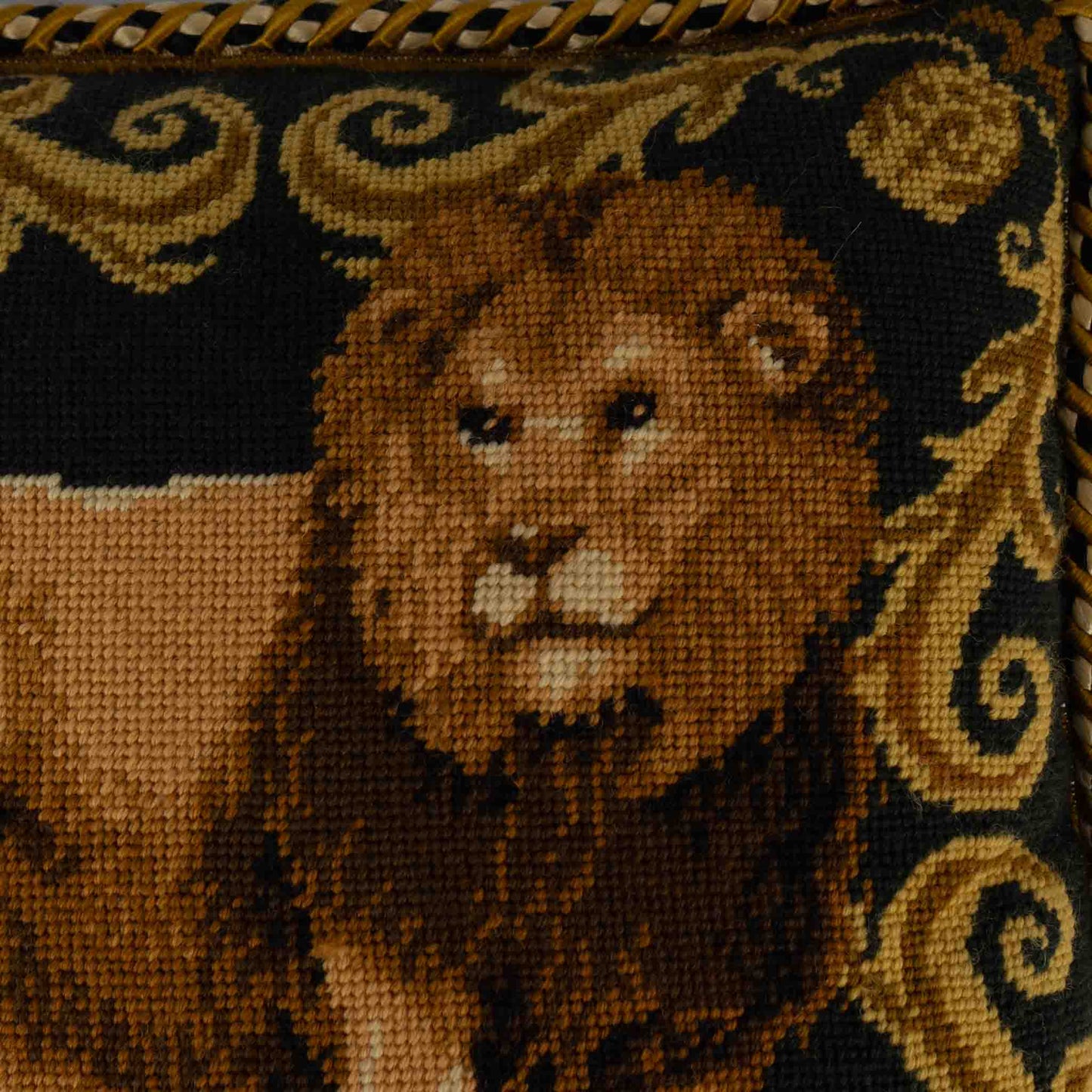 Close-up of needlepoint lion design showing intricate stitching detail