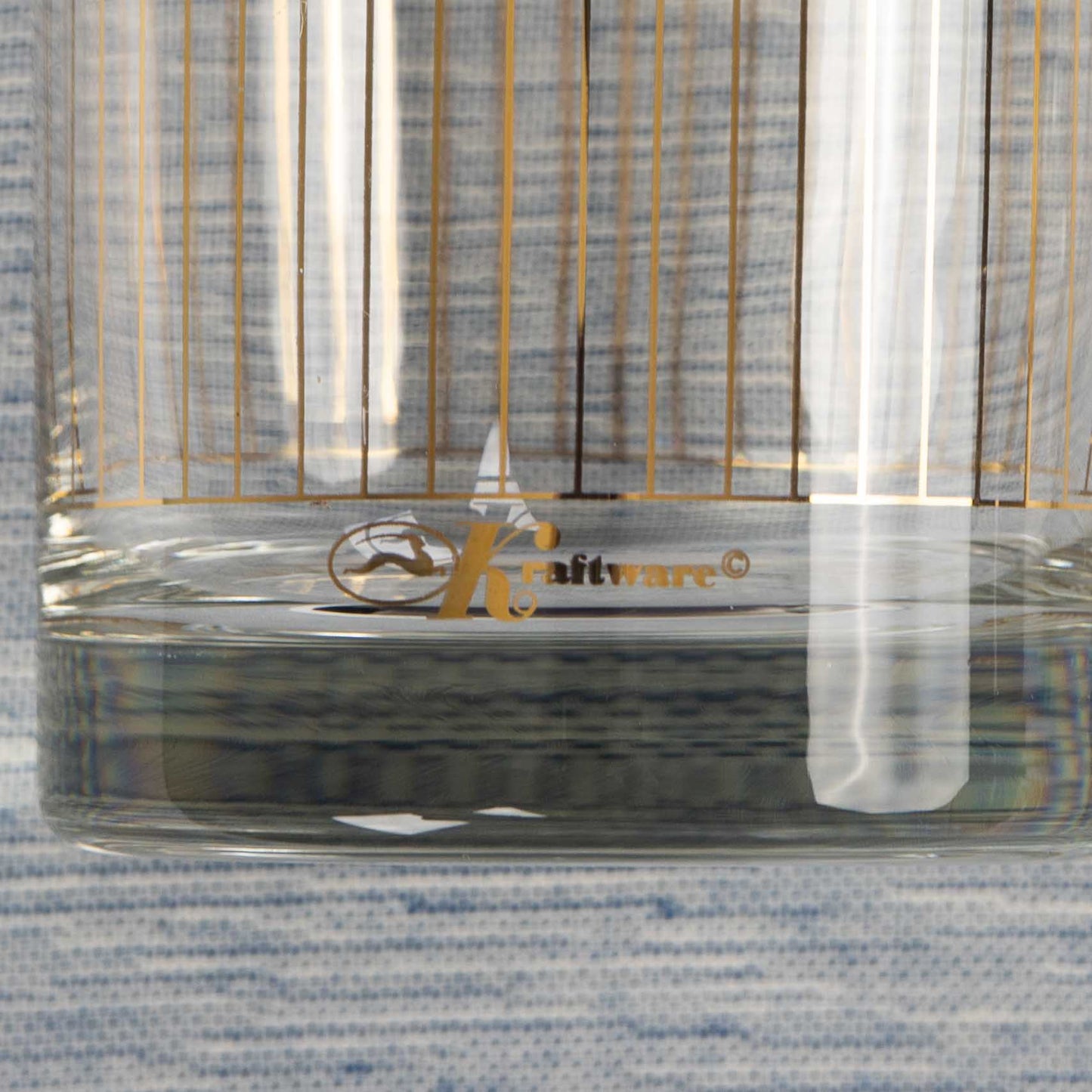 Vintage lowball glasses with thin gold stripe pattern, set of 9 pieces marked Kraftware from 1960s-1970s