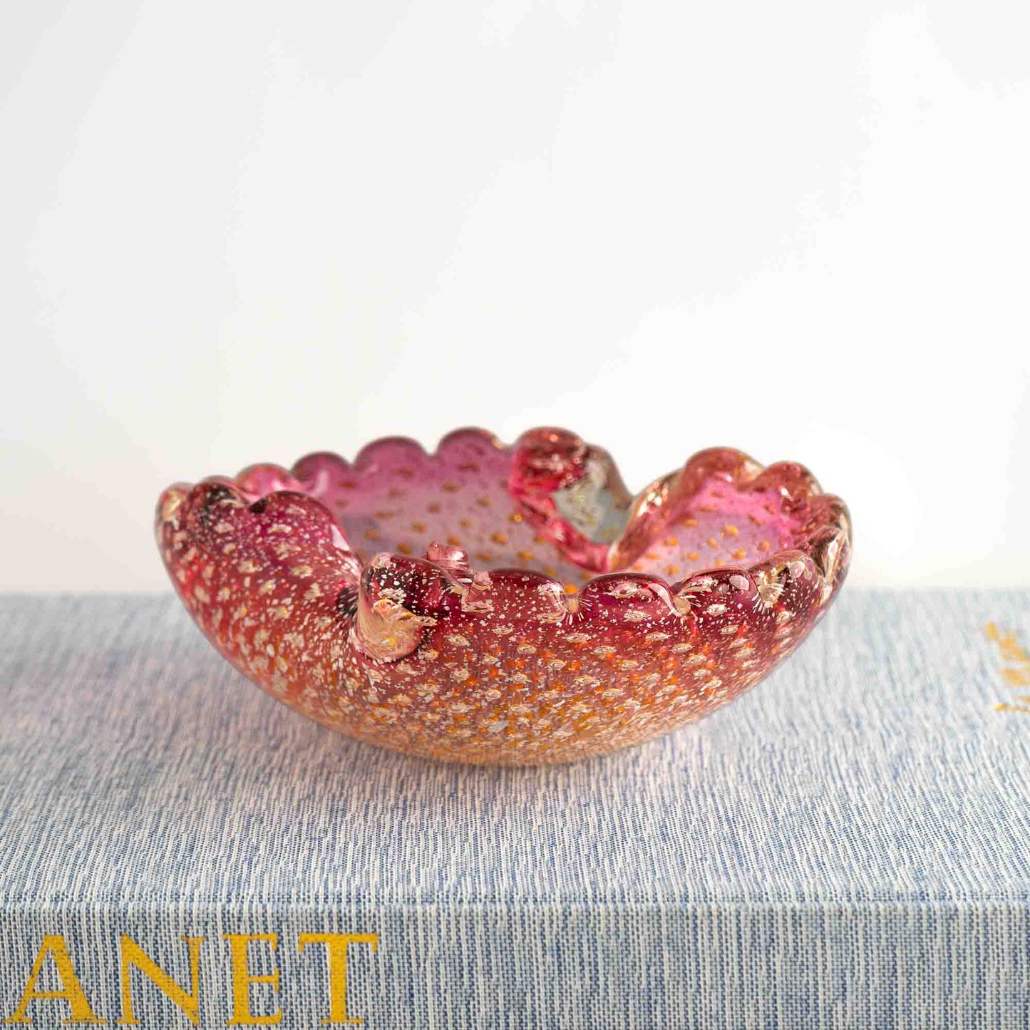 Vintage Murano Bullicante art glass catchall dish in pink and yellow with gold aventurine flecks and scalloped edge