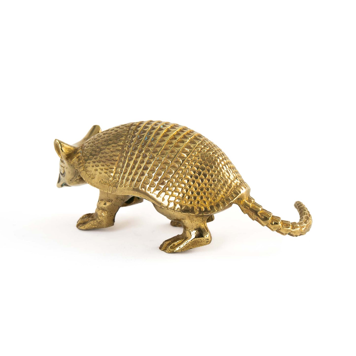Vintage solid cast brass armadillo figurine with detailed segmented shell, circa 1970s–1980s
