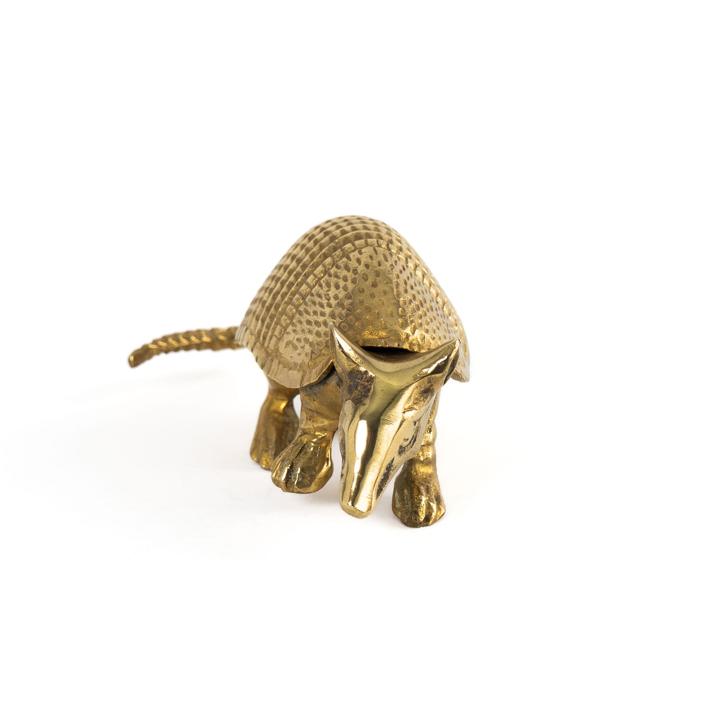 Vintage solid cast brass armadillo figurine with detailed segmented shell, circa 1970s–1980s