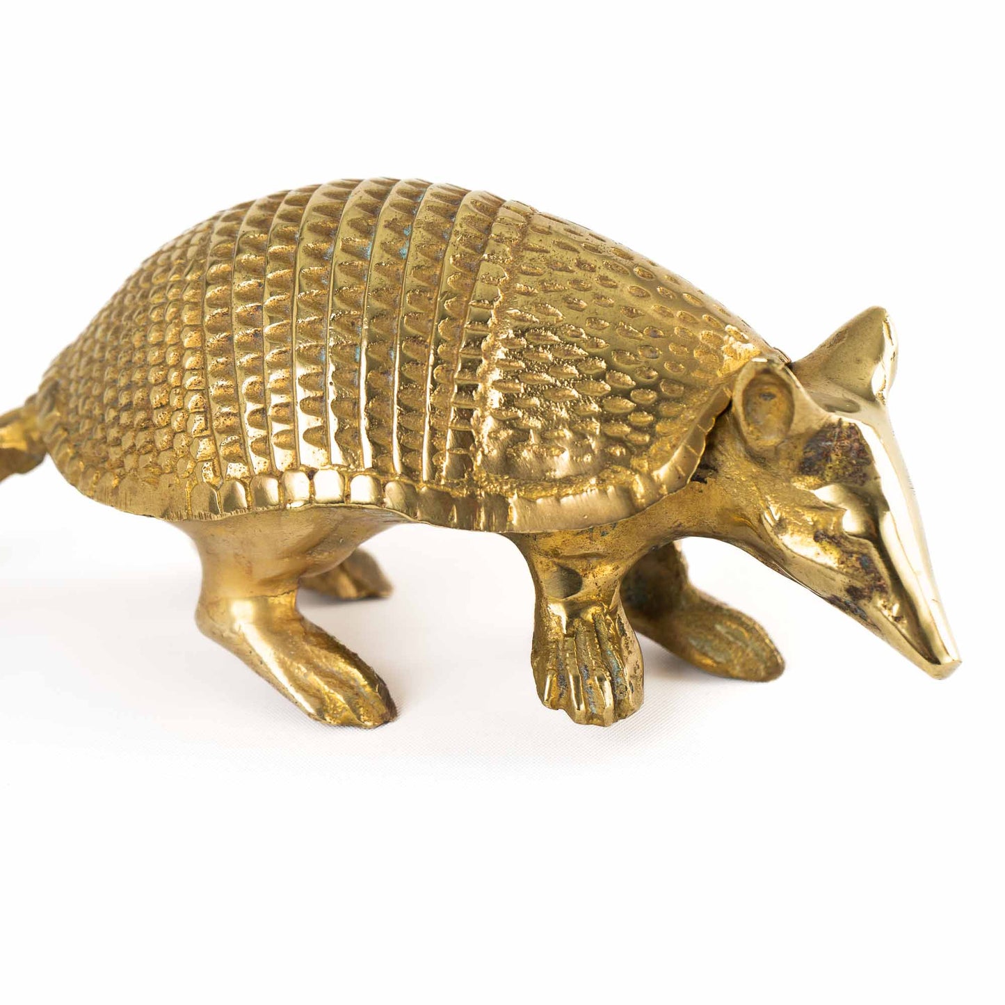 Vintage solid cast brass armadillo figurine with detailed segmented shell, circa 1970s–1980s