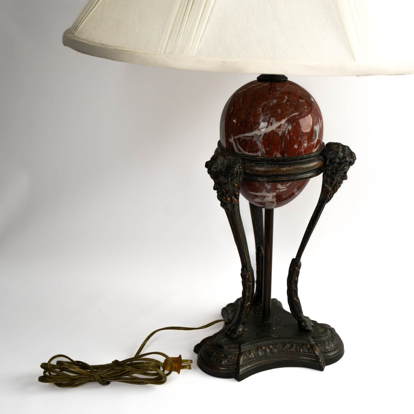 Vintage neoclassical athénienne table lamp with red Italian marble egg orb on dark bronze tripod base and ivory pleated shade