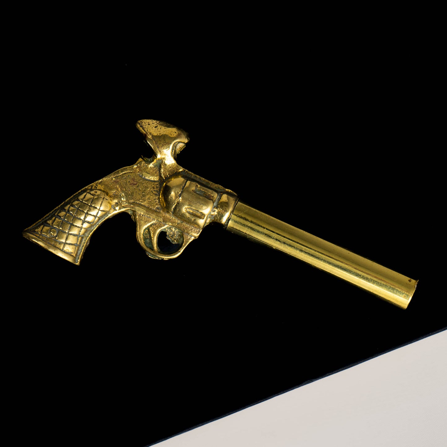 Vintage brass revolver-shaped corkscrew bottle opener 