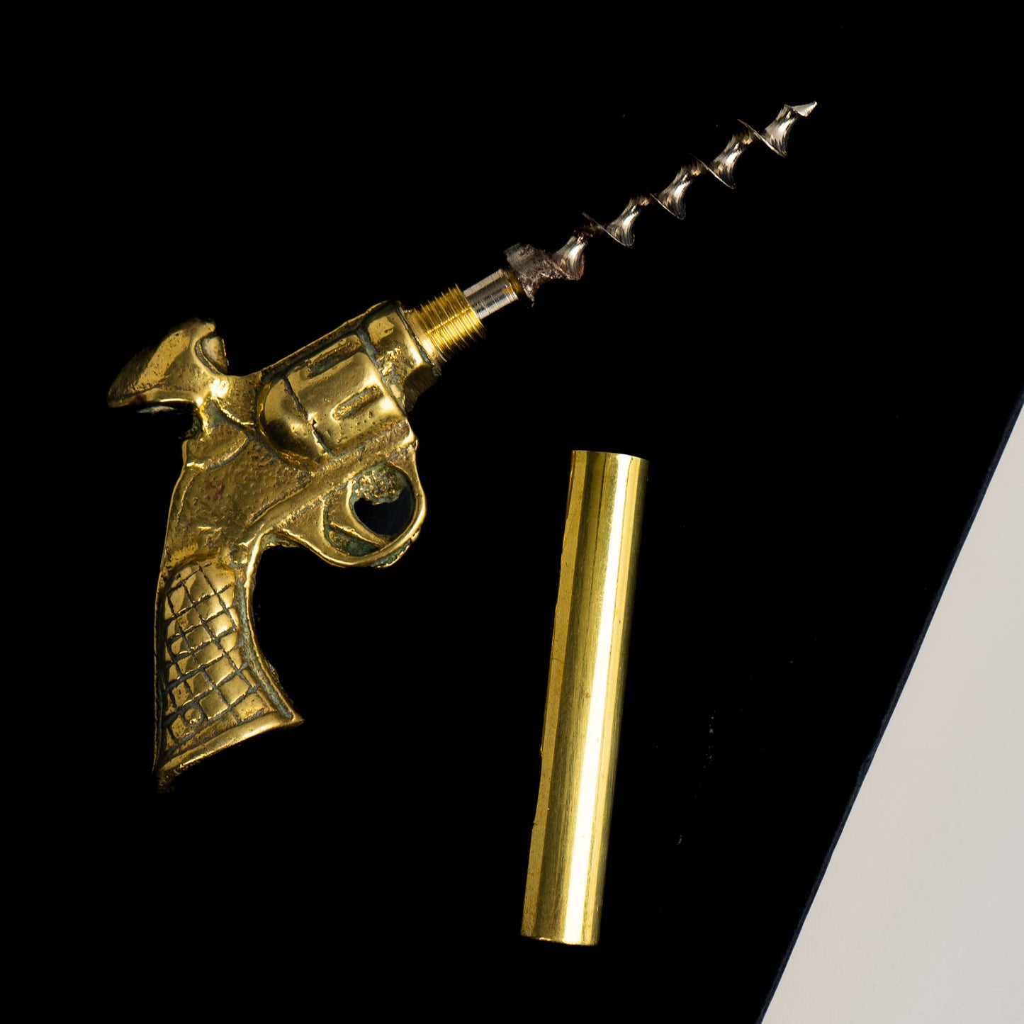 Vintage brass revolver-shaped corkscrew bottle opener 