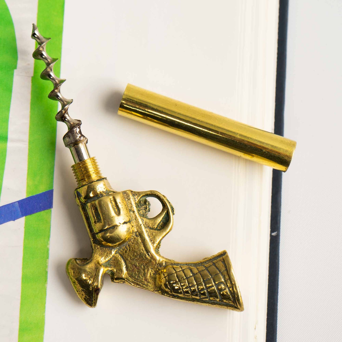 Vintage brass revolver-shaped corkscrew bottle opener 