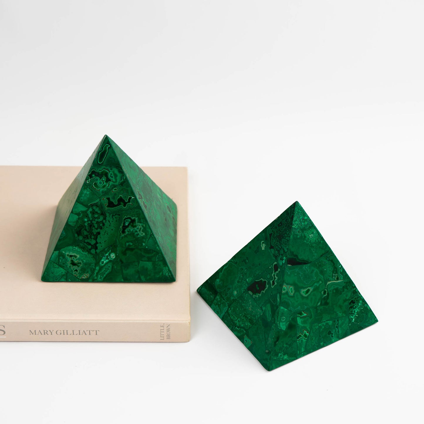 green malachite pyramid sculptures styled with vintage decor 