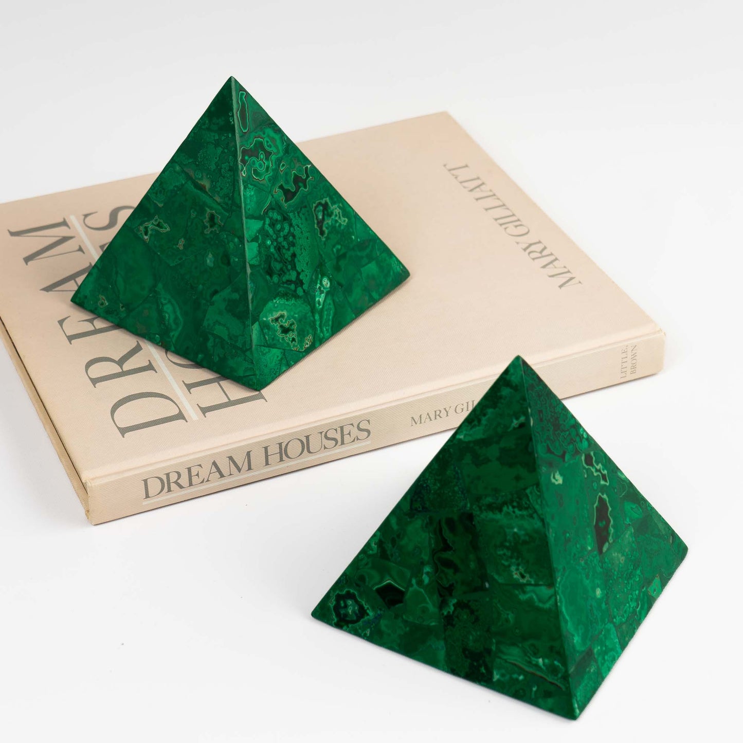 green malachite pyramid sculptures styled with vintage decor 