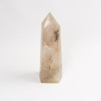 Tall smokey gray quartz crystal tower, 10 inches, with natural translucent faceting and a polished point