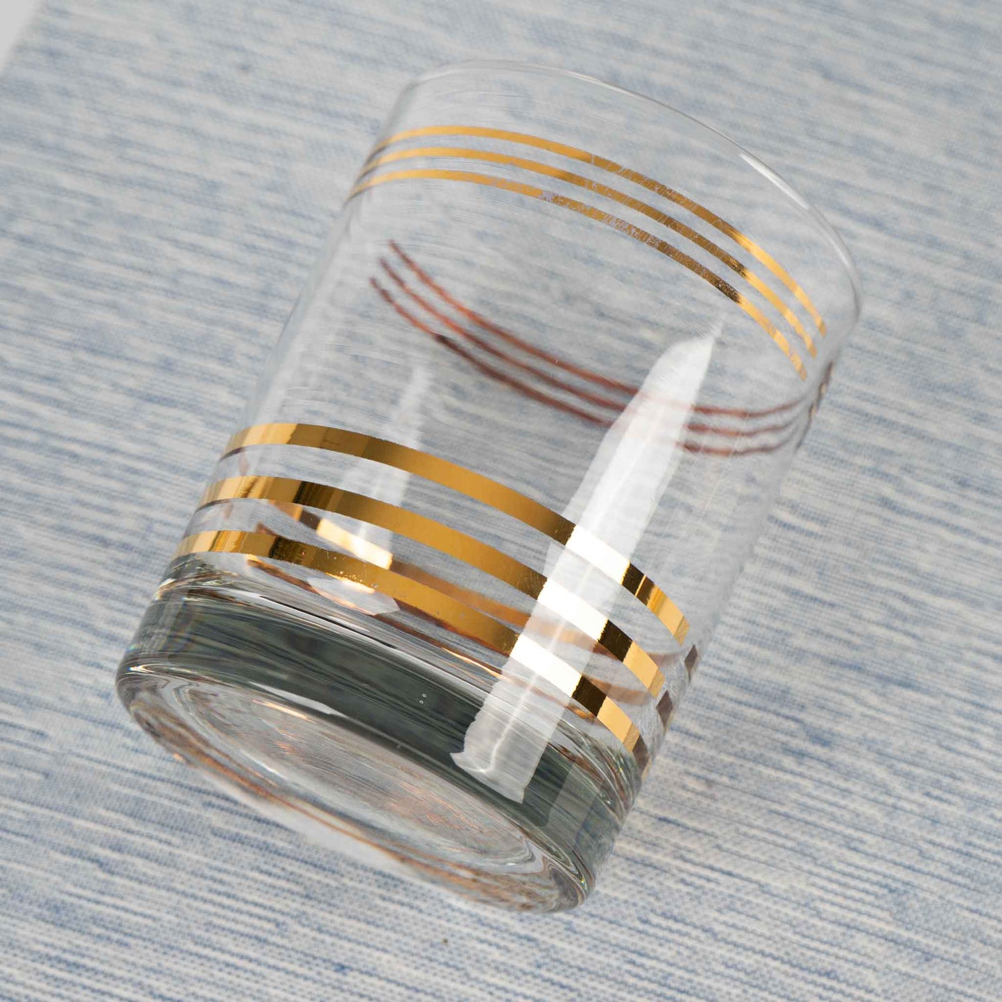 vintage lowball cocktail glass with horizontal gold stripes 