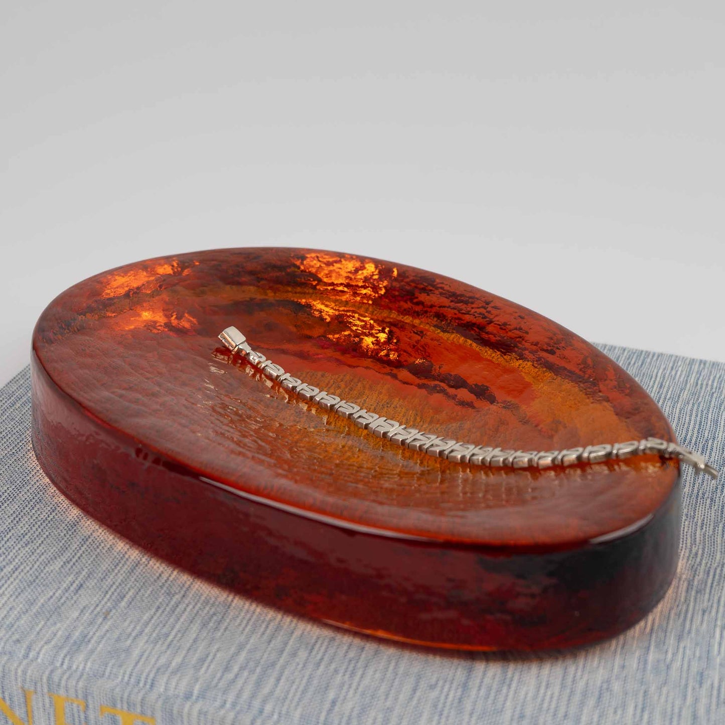 Vintage amber Murano glass freeform catchall bowl by Vincenzo Nason from the 1970s, featuring organic curved shape and textured glass surface with artist signature