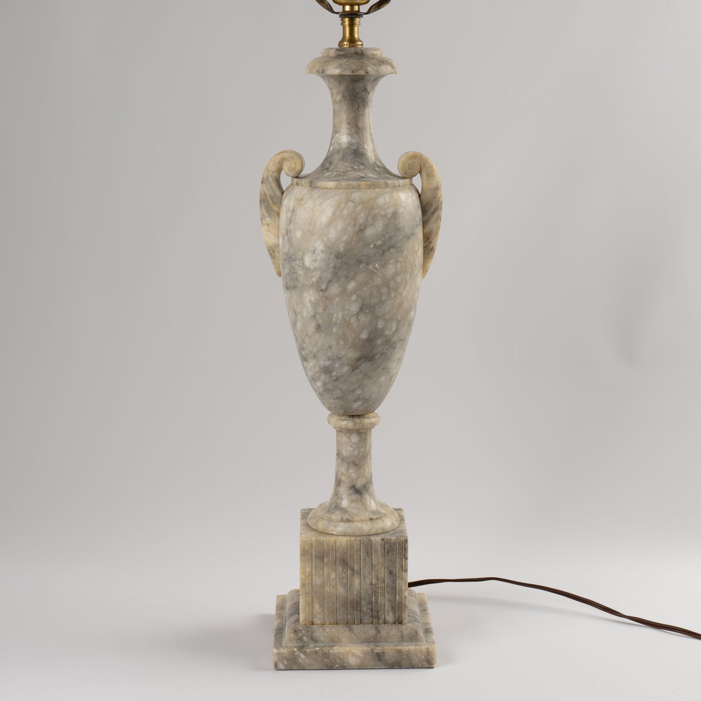 Vintage 1950s neoclassical marble table lamp with urn shape, side handles, and tiered square base 