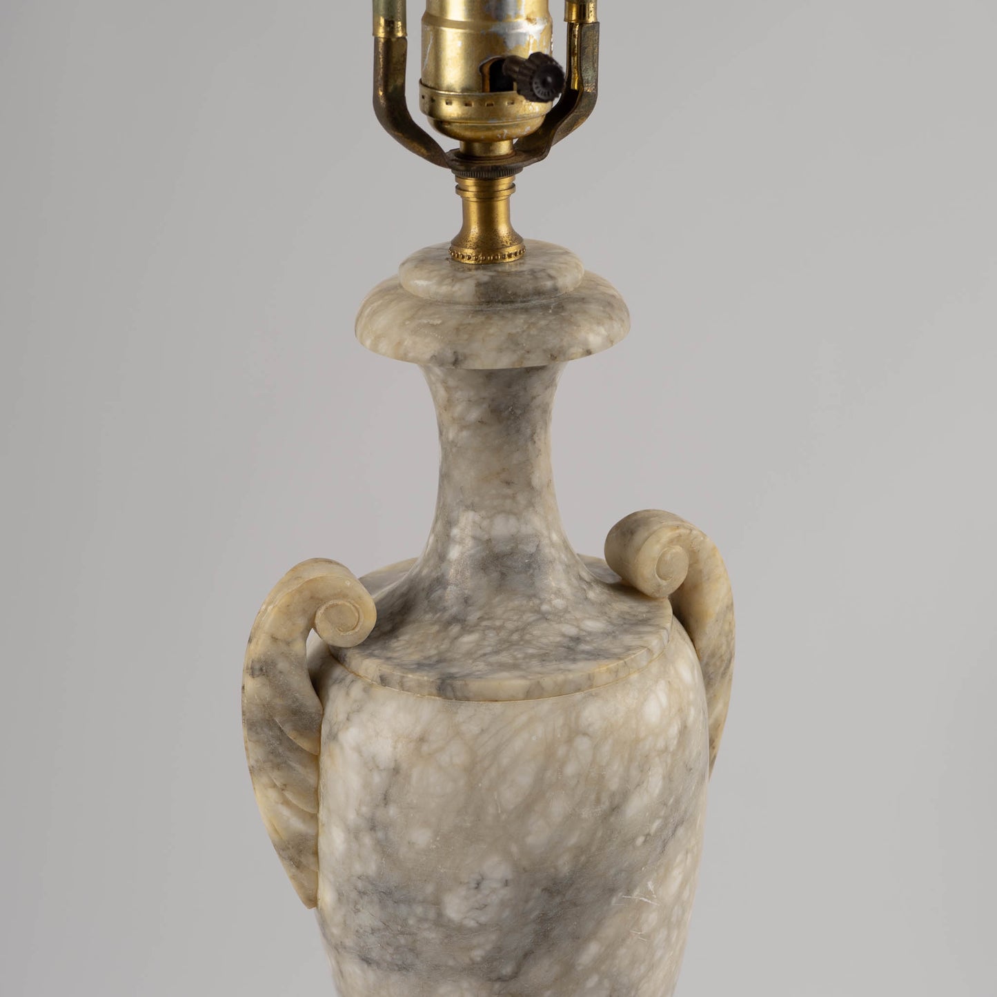 Vintage 1950s neoclassical marble table lamp with urn shape, side handles, and tiered square base 
