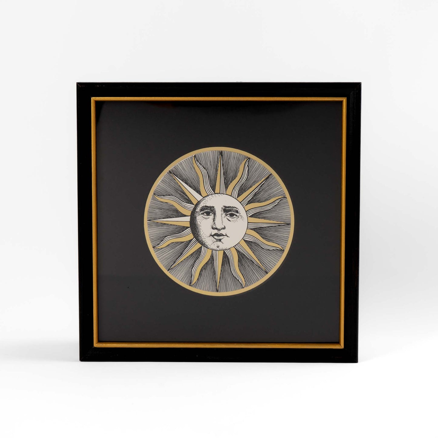 Vintage Piero Fornasetti Sole VI framed etching showing stylized sun face design in black frame with gold accent and black mat, from the famous Soli e Lune series