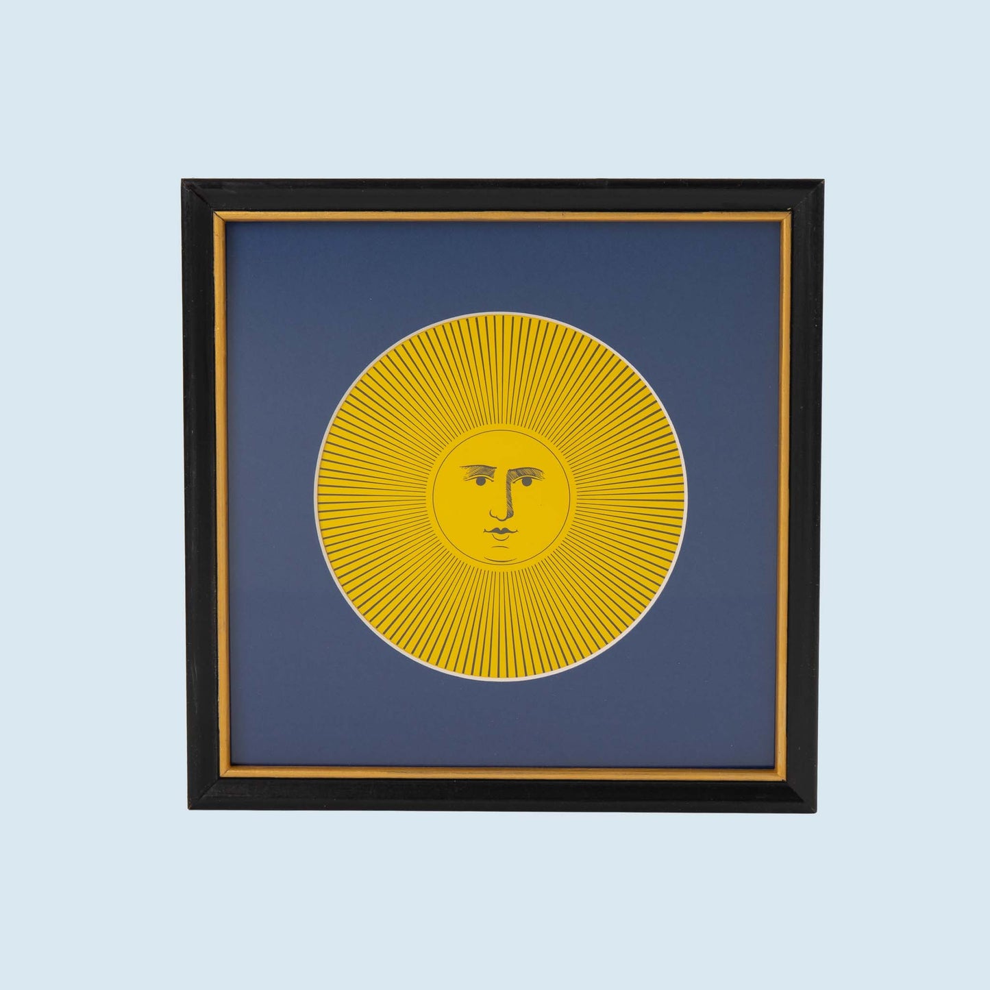 Vintage Piero Fornasetti Sol XI yellow sun print featuring intricate black line art on white paper, displayed in black frame with gold accent and blue mat