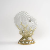 Vintage nautilus shell-shaped porcelain vase with green coral and gold accents on off-white ceramic base in the style of Royal Worcester, England
