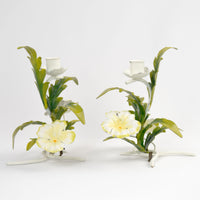Vintage 1960s Italian tole metal candlestick holders with hand-painted white and yellow floral design and green leaves