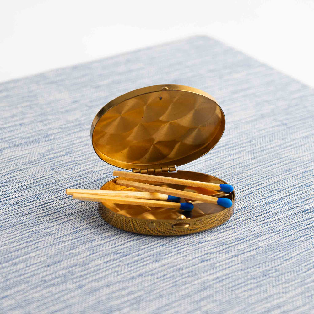 
                  
                    vintage oval brass pocket ashtray with painted cigarette design
                  
                