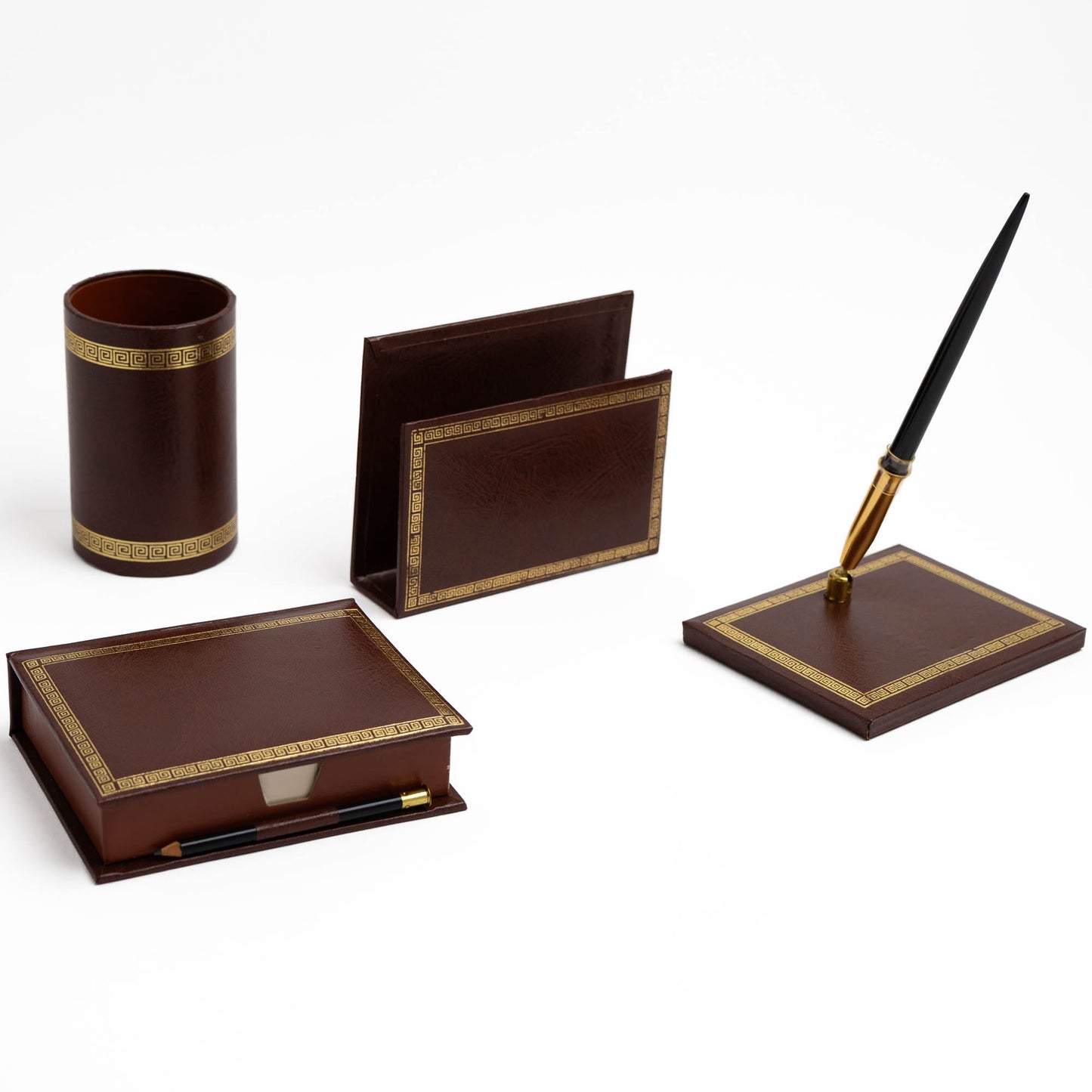 Vintage brown leather desk set with gold Greek key trim, showing all four pieces arranged together.