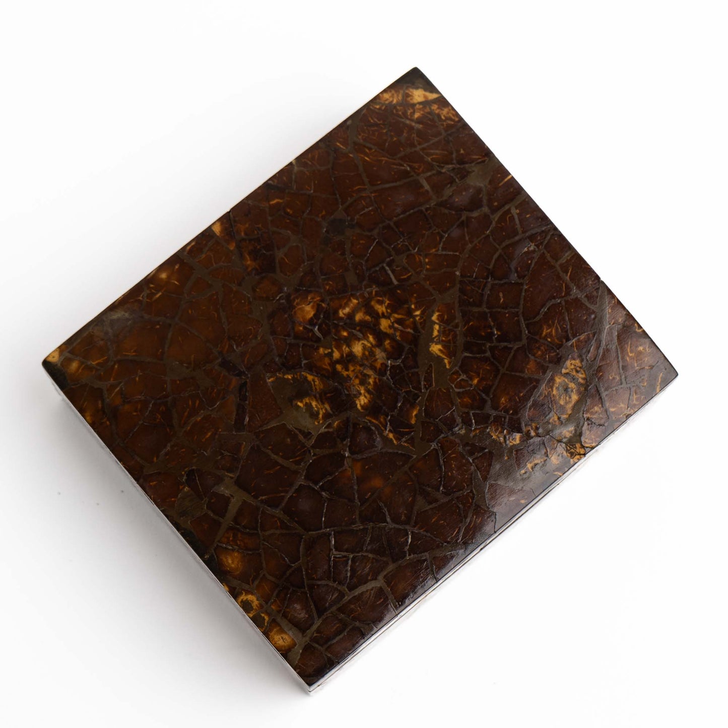 Close-up of tessellated coconut shell mosaic pattern on vintage lidded box