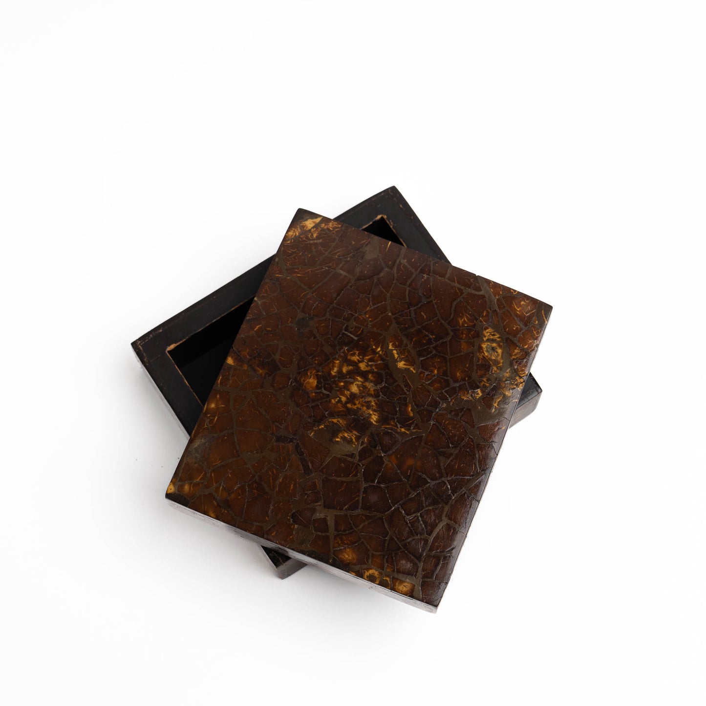 Close-up of tessellated coconut shell mosaic pattern on vintage lidded box