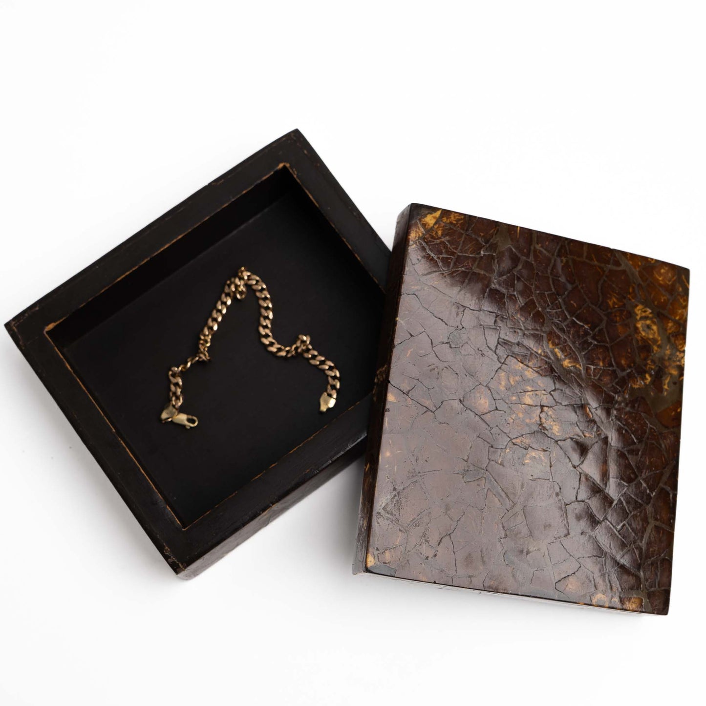 Vintage coconut shell  jewelry box shown open, revealing interior storage space