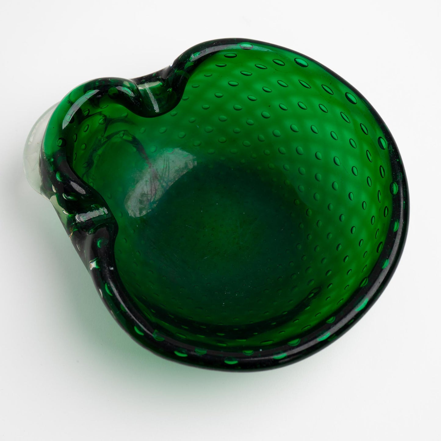 Vintage emerald green Murano glass bullicante catchall dish with controlled bubble pattern, top view
