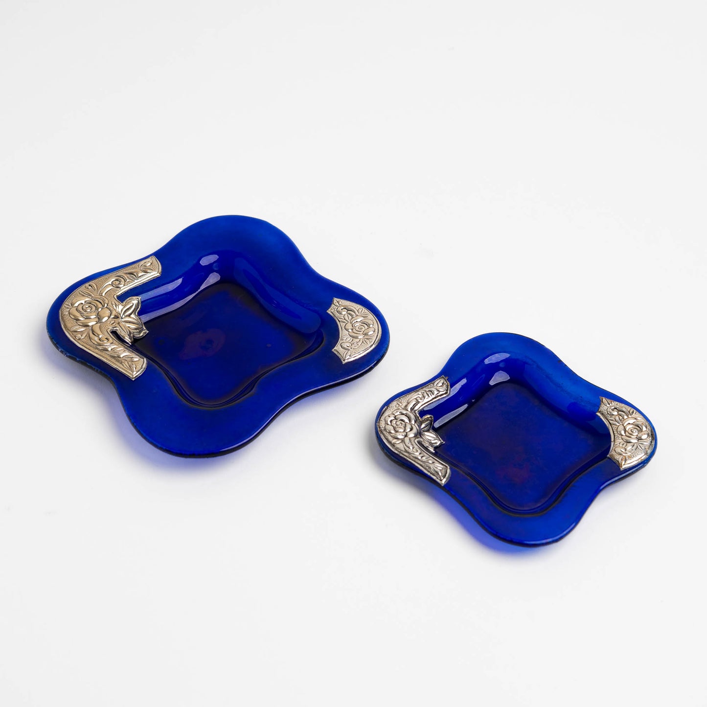 Set of two vintage cobalt blue square glass catchalls with silver-plated floral rose overlay design