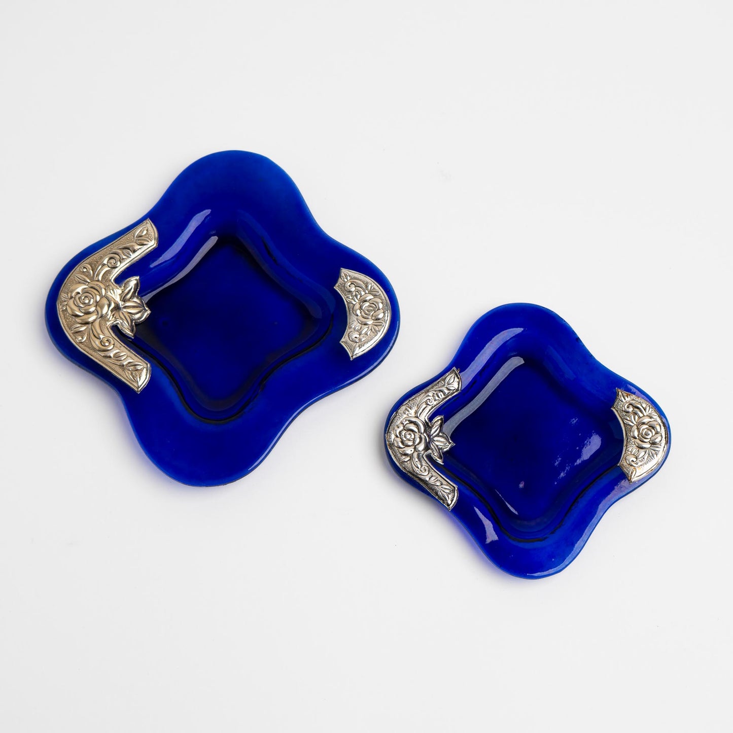 Set of two vintage cobalt blue square glass catchalls with silver-plated floral rose overlay design