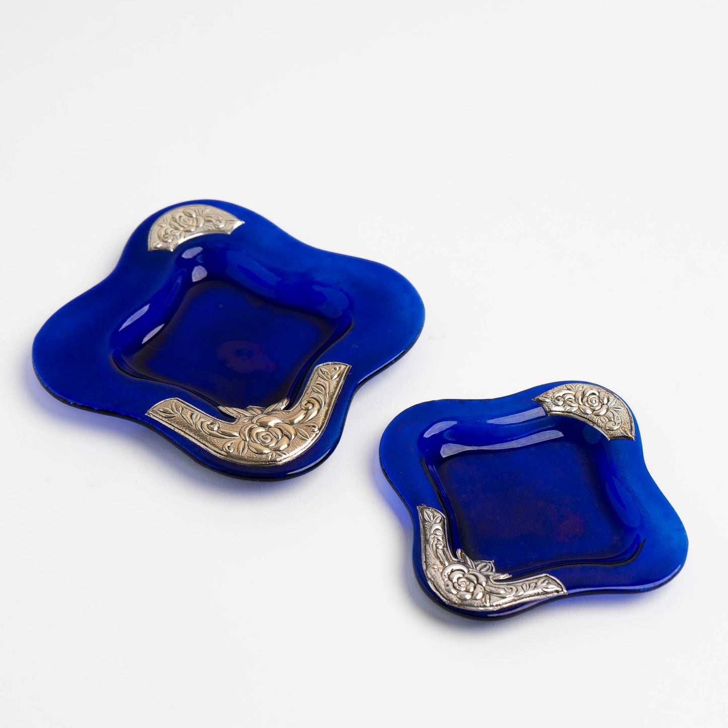 Set of two vintage cobalt blue square glass catchalls with silver-plated floral rose overlay design