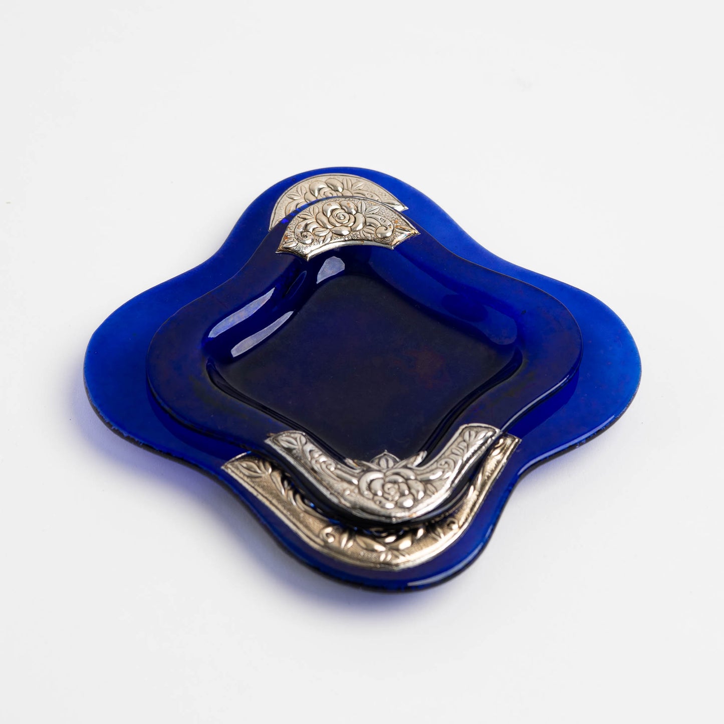 Set of two vintage cobalt blue square glass catchalls with silver-plated floral rose overlay design, shown stacked