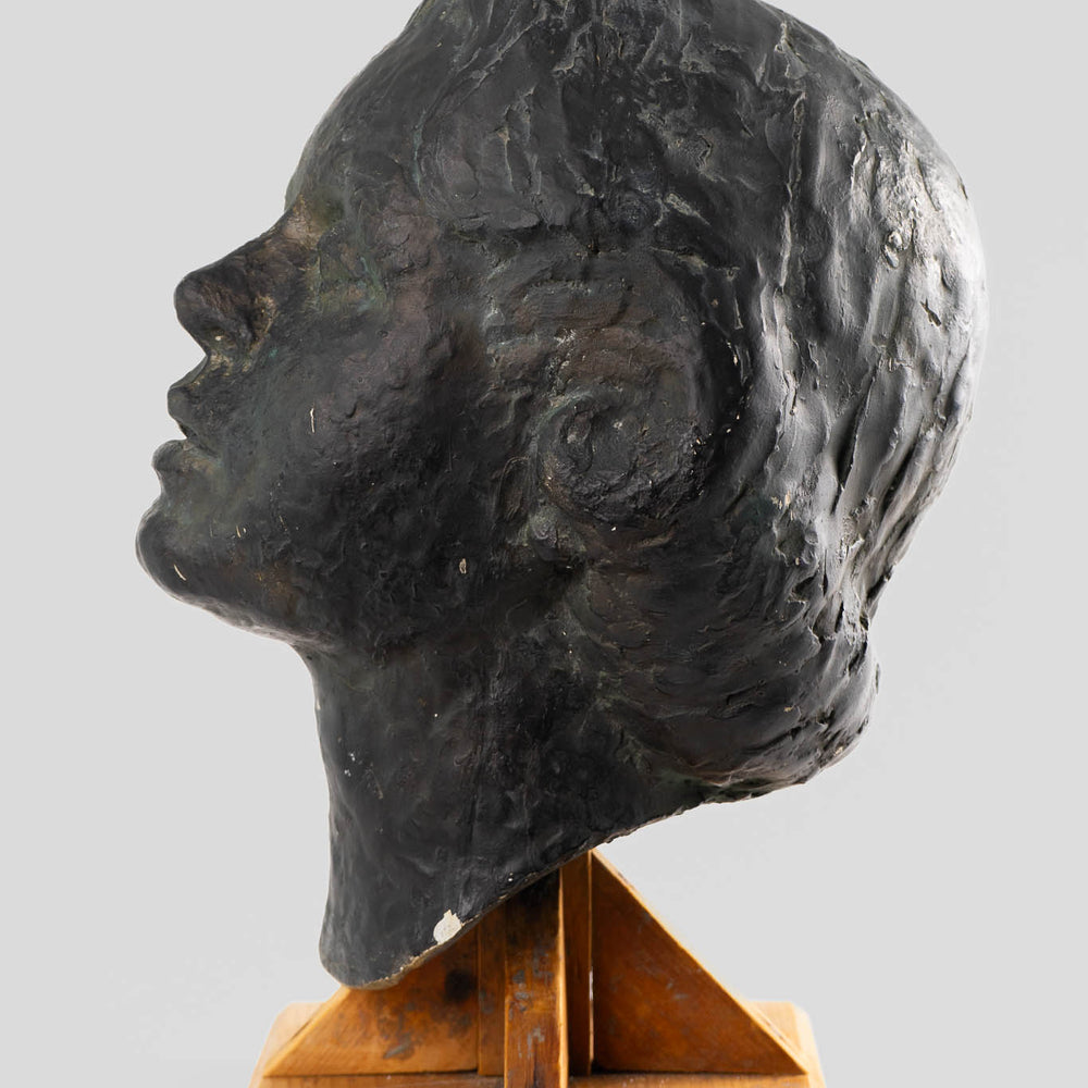 
                      
                        Figurative Plaster Woman's Face Sculpture on Rustic Wood Stand
                      
                    