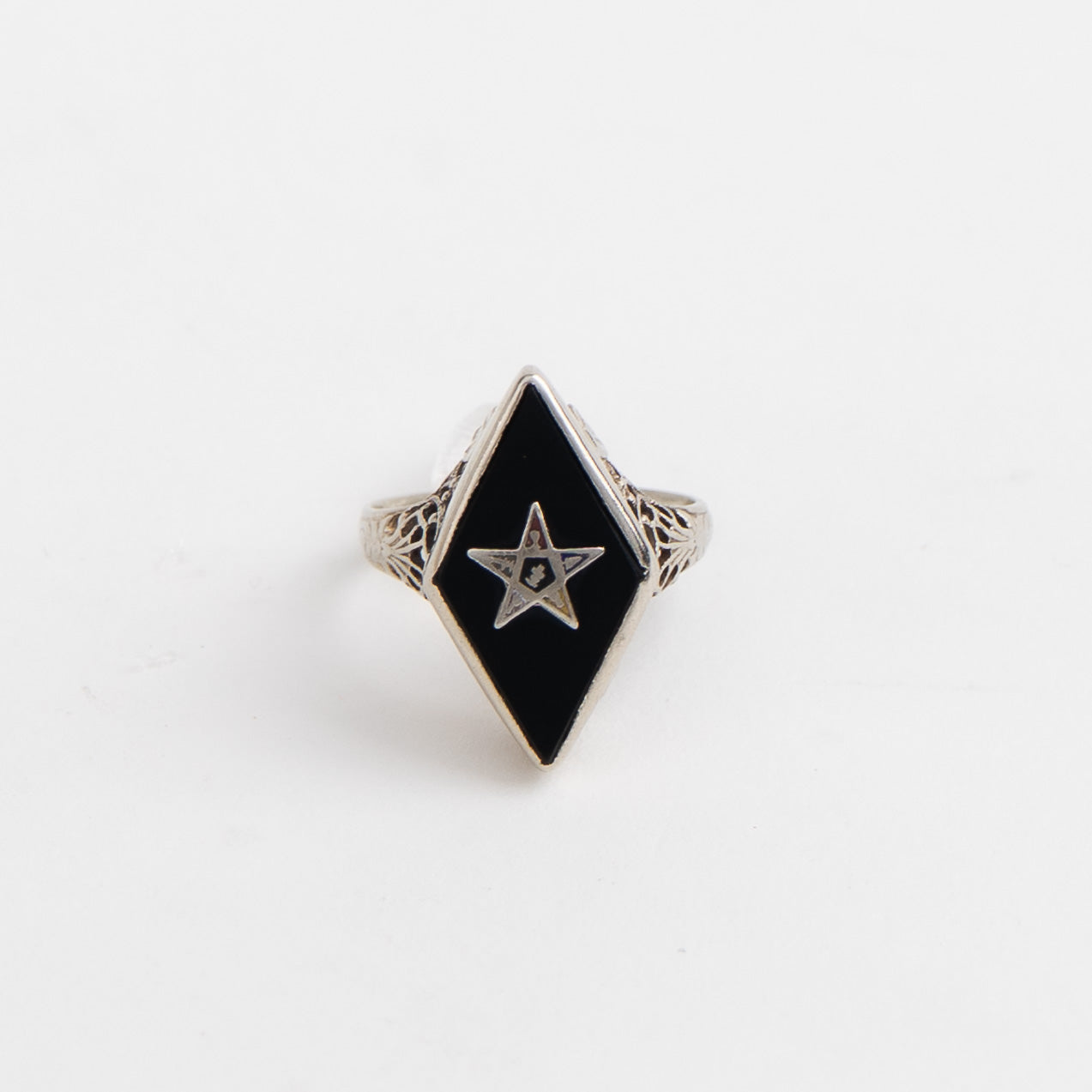 Vintage 14k white gold masonic ring with black onyx stone featuring Eastern Star symbol inlay, showing Art Nouveau decorative details on band sides