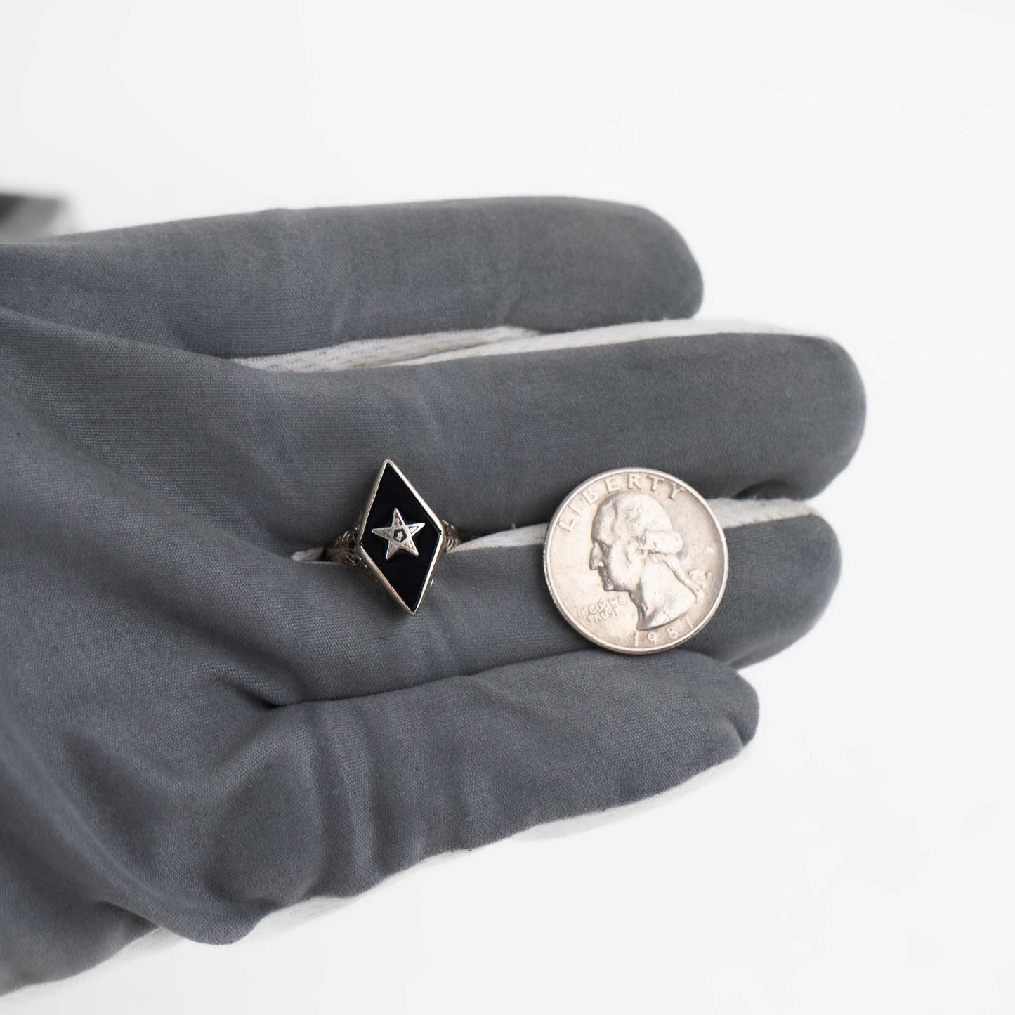 Vintage 14k white gold masonic ring with black onyx stone featuring Eastern Star symbol inlay, showing Art Nouveau decorative details on band sides