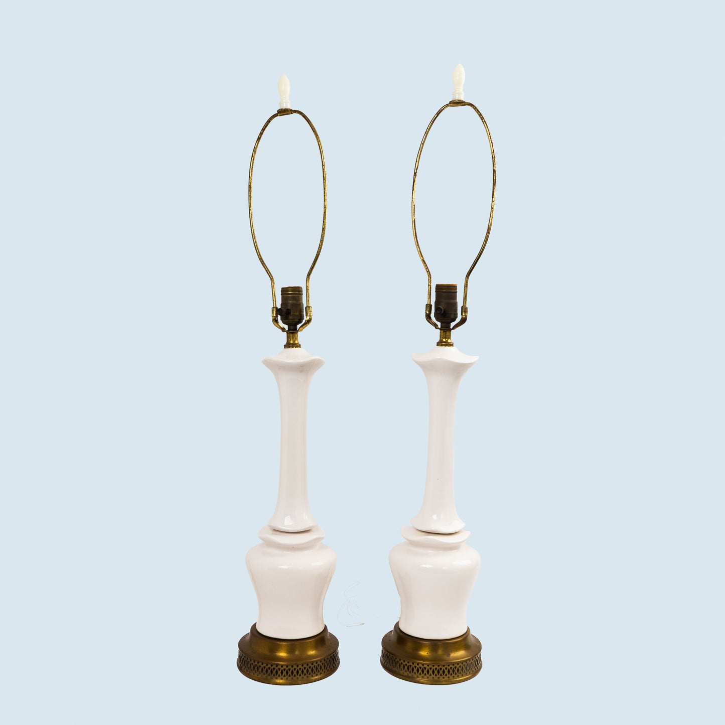 Pair of vintage mid-century off-white ceramic chinoiserie lamp bases with original harps and finials, circa 1950s–1960s.