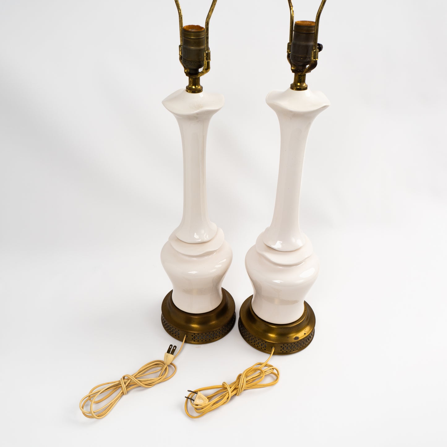Pair of vintage mid-century off-white ceramic chinoiserie lamp bases with original harps and finials, circa 1950s–1960s.
