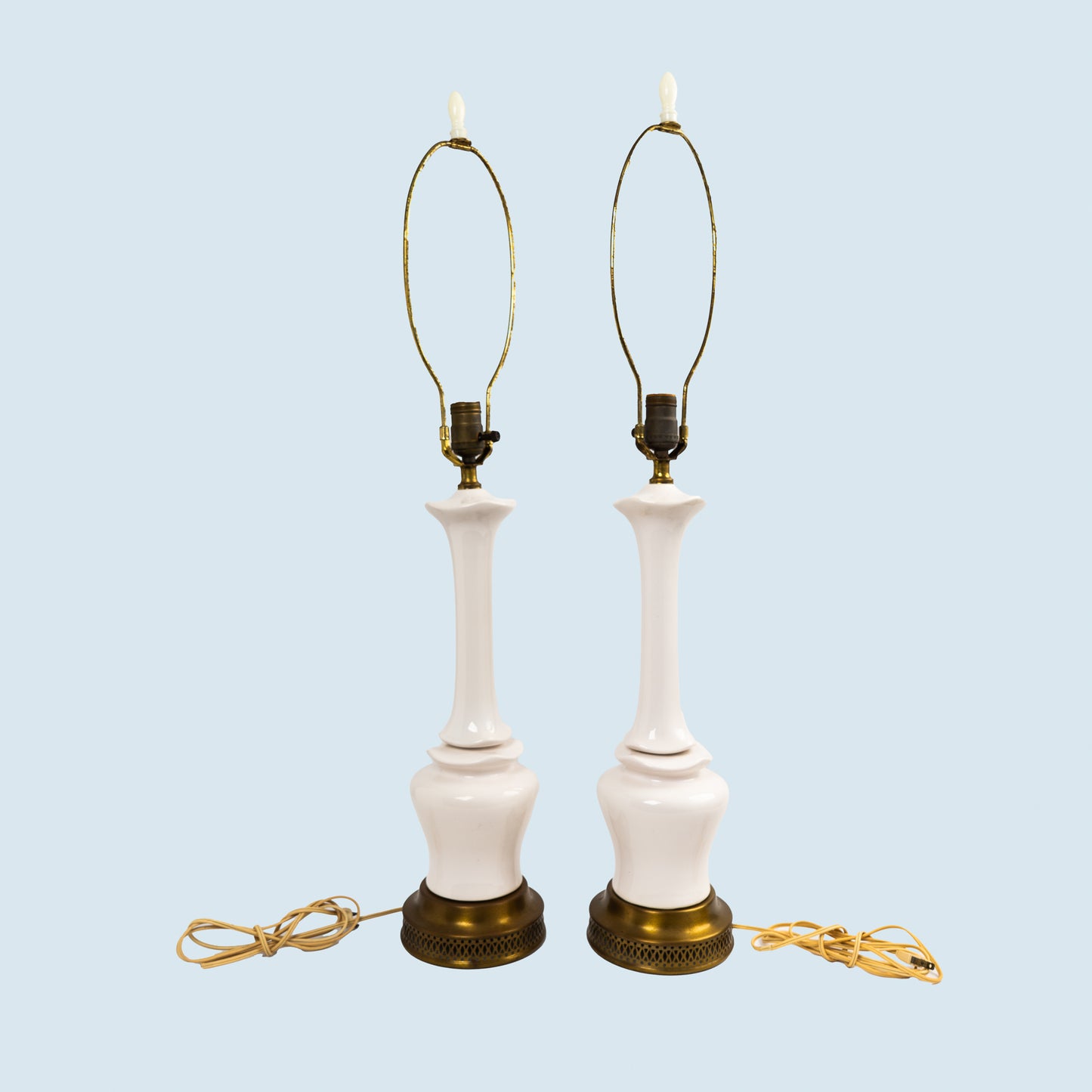 Pair of vintage mid-century off-white ceramic chinoiserie lamp bases with original harps and finials, circa 1950s–1960s.